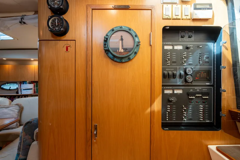  Yacht Photos Pics Interior of 1998 Tiara Yachts 4300 Open with control panel and wooden cabinetry.