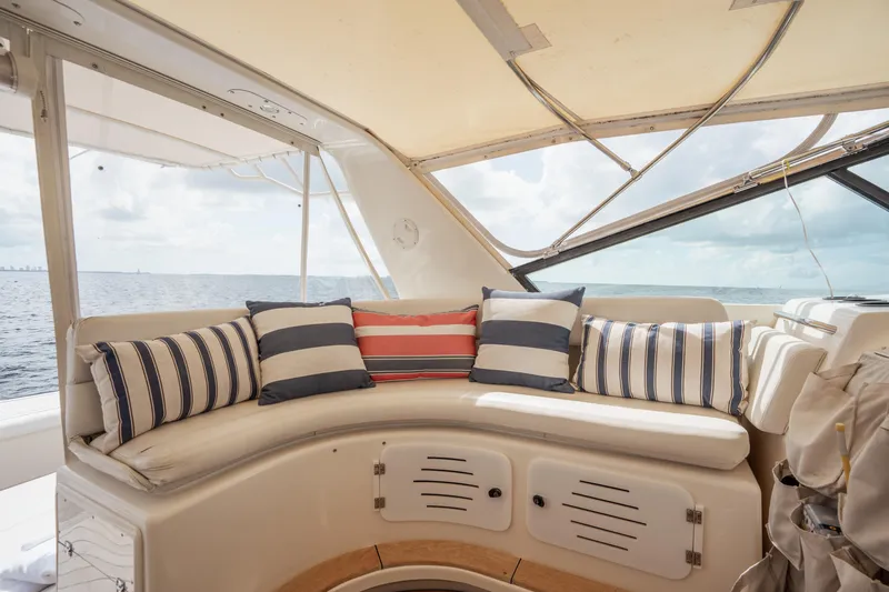  Yacht Photos Pics Cozy seating area on a 1998 Tiara Yachts 4300 Open with striped cushions, ocean view.