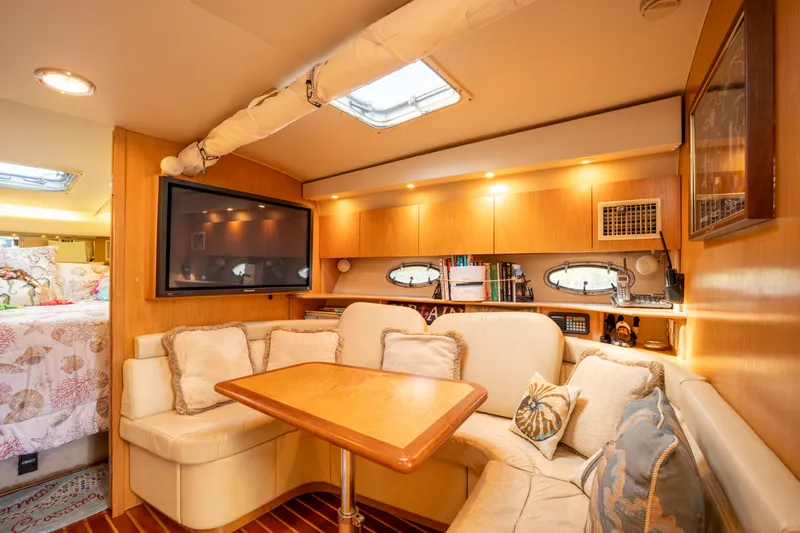  Yacht Photos Pics Luxurious interior of 1998 Tiara Yachts 4300 Open with cozy seating and elegant decor.