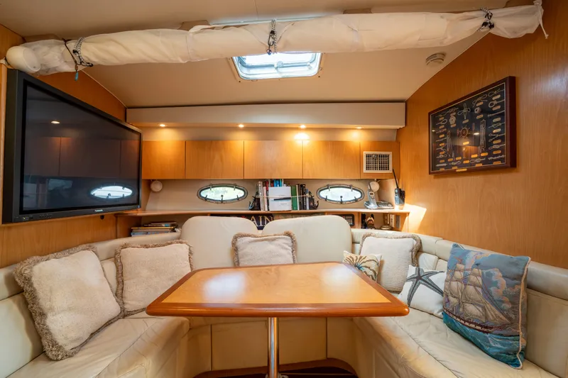  Yacht Photos Pics Luxurious interior of 1998 Tiara Yachts 4300 Open with cozy seating and elegant decor.