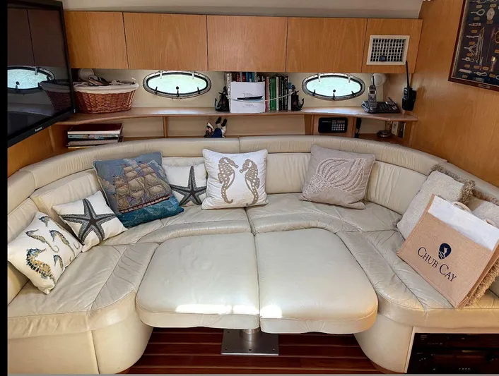  Yacht Photos Pics Luxurious 1998 Tiara Yachts 4300 Open interior with plush seating and nautical-themed decor.
