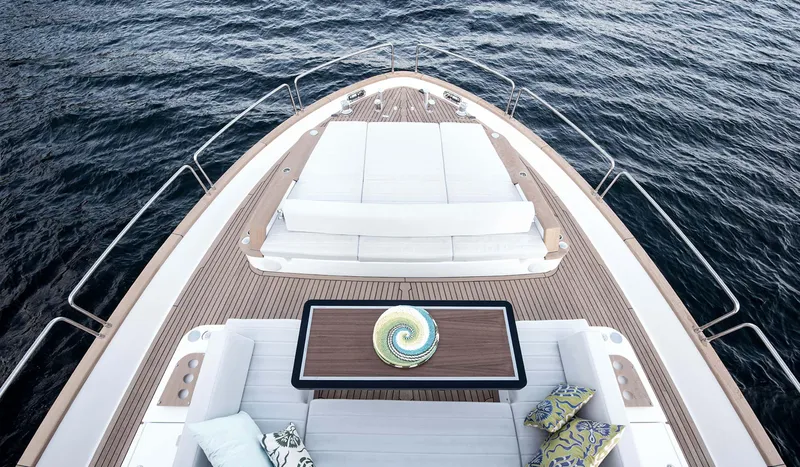  Yacht Photos Pics Luxurious 2022 Sirena 68 yacht deck with elegant seating and ocean view.
