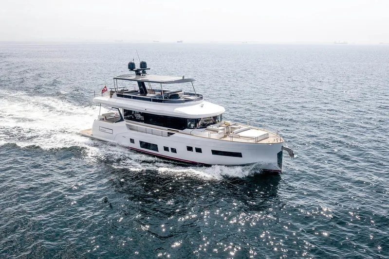  Yacht Photos Pics 2022 Sirena 68 yacht cruising on open water, showcasing sleek design and luxury features.