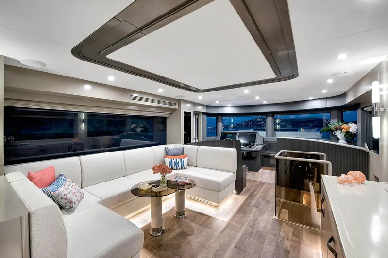  Yacht Photos Pics Luxurious interior of 2022 Sirena 68 yacht with modern furnishings and panoramic windows.