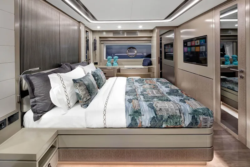  Yacht Photos Pics Luxurious bedroom interior of 2022 Sirena 68 yacht with modern decor and elegant bedding.