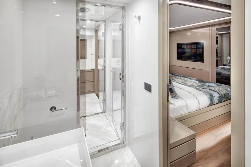  Yacht Photos Pics Luxurious interior of 2022 Sirena 68 yacht featuring modern bathroom and cozy bedroom.