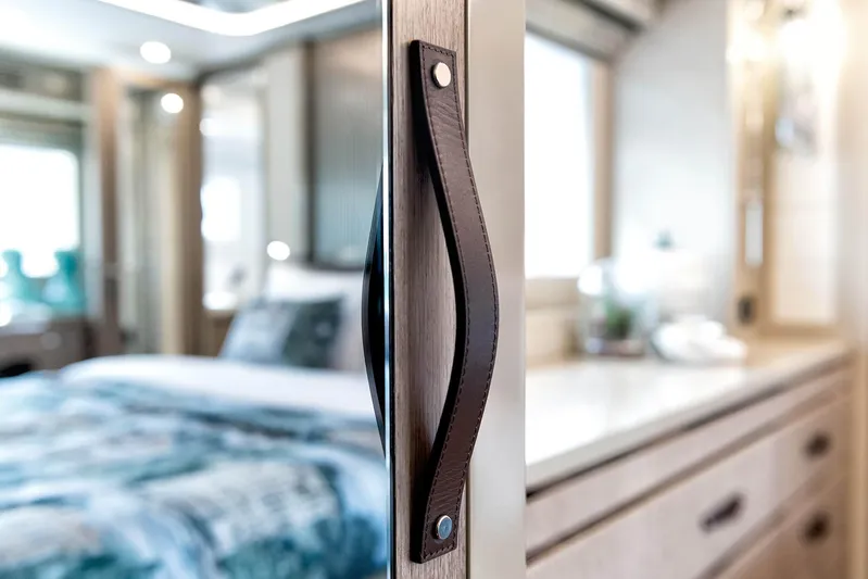  Yacht Photos Pics Luxurious interior of 2022 Sirena 68 yacht, featuring elegant bedroom and modern design elements.