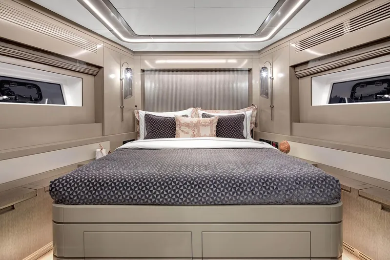  Yacht Photos Pics Luxurious bedroom interior of 2022 Sirena 68 yacht with modern design and elegant bedding.