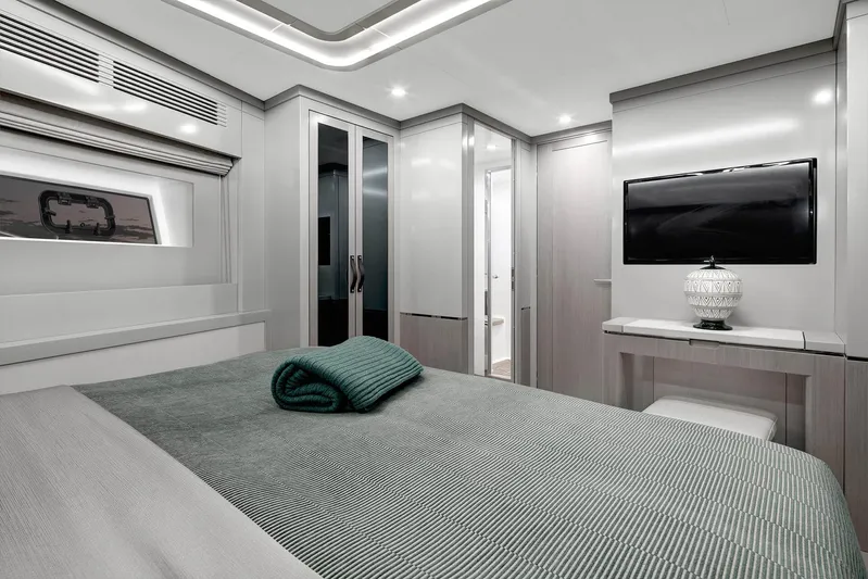  Yacht Photos Pics Luxurious bedroom interior of 2022 Sirena 68 yacht with modern decor and amenities.