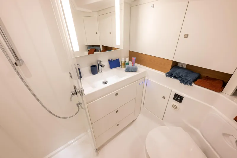  Yacht Photos Pics Luxurious bathroom in 2026 Jeanneau Sun Odyssey 455 yacht, featuring modern fixtures and elegant design.