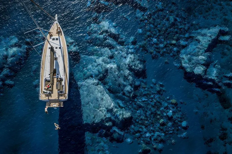  Yacht Photos Pics Aerial view of Jeanneau Sun Odyssey 455 sailing over clear blue waters, 2026 model.