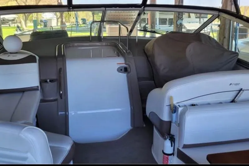  Yacht Photos Pics 2008 Cruisers Yachts 330 Express interior with seating and helm, docked outdoors.