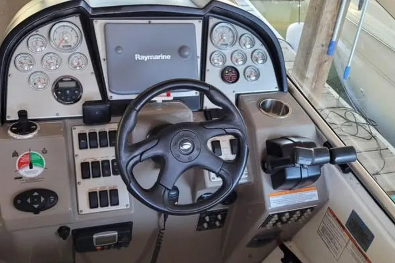  Yacht Photos Pics 2008 Cruisers Yachts 330 Express helm with Raymarine display and gauges.