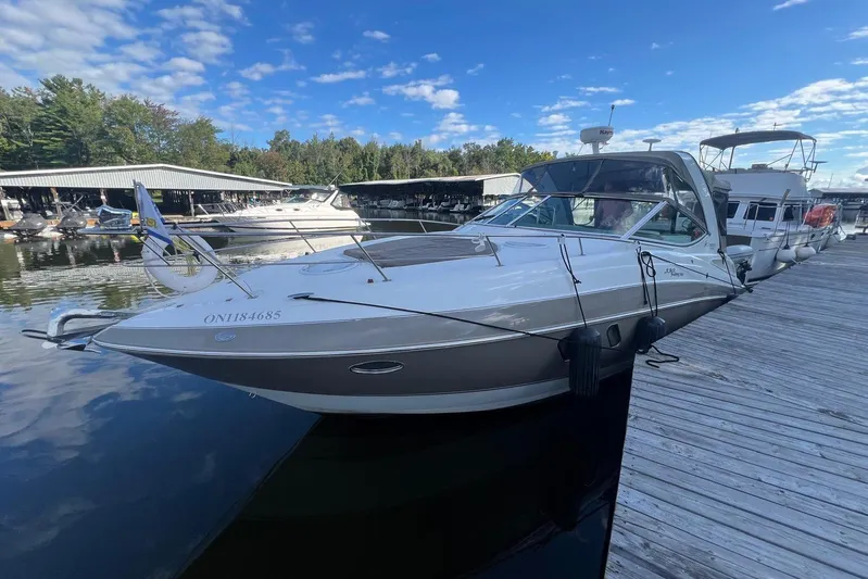  Yacht Photos Pics 2008 Cruisers Yachts 330 Express docked at marina under blue sky.