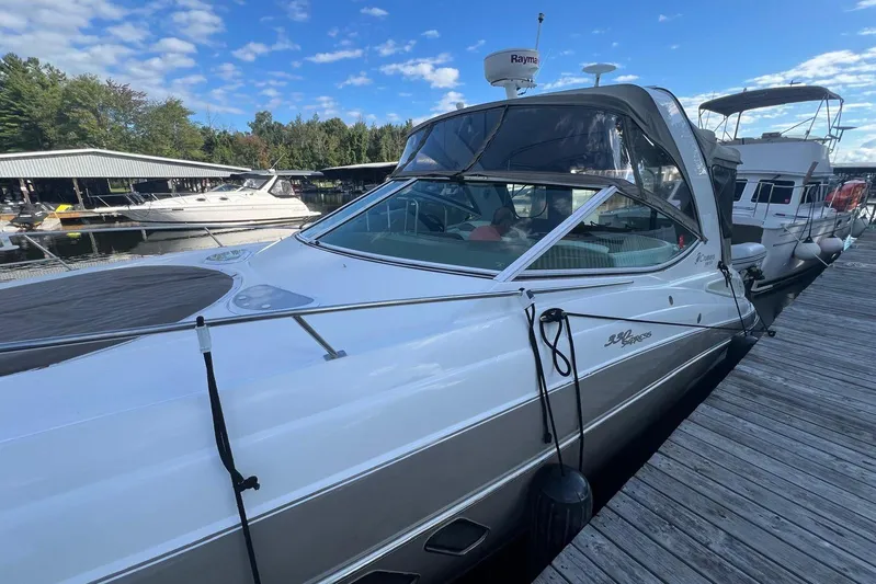  Yacht Photos Pics 2008 Cruisers Yachts 330 Express docked at marina under clear blue sky.