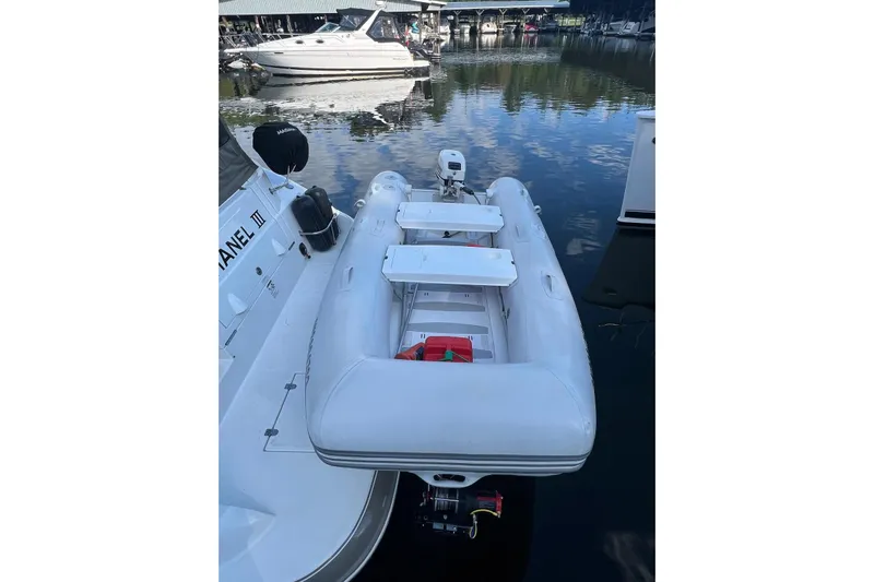  Yacht Photos Pics 2008 Cruisers Yachts 330 Express with inflatable dinghy docked at marina.