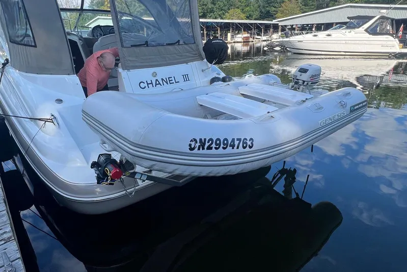  Yacht Photos Pics 2008 Cruisers Yachts 330 Express with inflatable boat docked at marina.