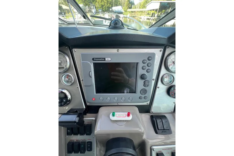  Yacht Photos Pics 2008 Cruisers Yachts 330 Express dashboard with Raymarine navigation system and gauges.