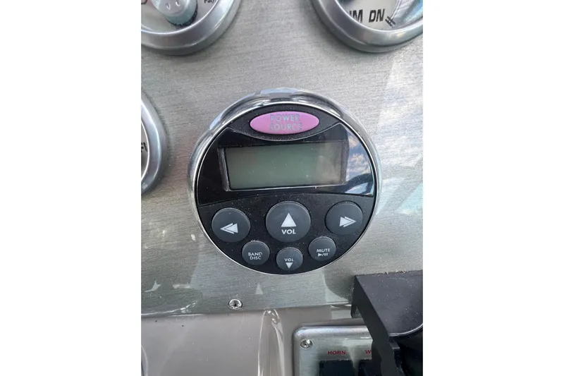  Yacht Photos Pics Control panel of a 2008 Cruisers Yachts 330 Express with audio system buttons.