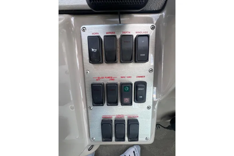  Yacht Photos Pics Control panel of a 2008 Cruisers Yachts 330 Express with labeled switches.
