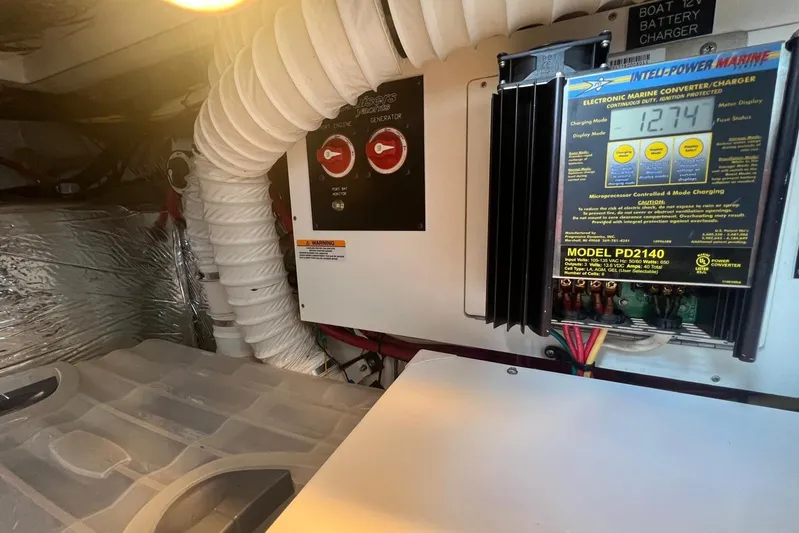  Yacht Photos Pics 2008 Cruisers Yachts 330 Express engine room with electronic marine converter and charger.