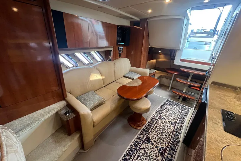  Yacht Photos Pics Luxurious interior of 2008 Cruisers Yachts 330 Express with elegant seating and wooden finishes.