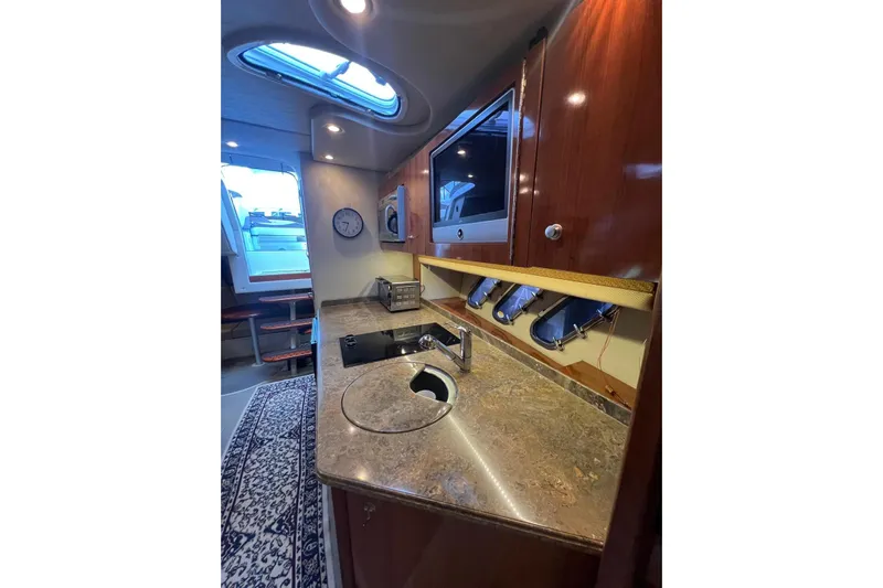  Yacht Photos Pics Luxurious 2008 Cruisers Yachts 330 Express interior with modern kitchen amenities.