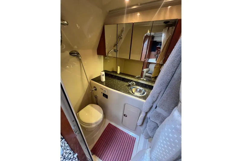  Yacht Photos Pics 2008 Cruisers Yachts 330 Express bathroom with modern fixtures and elegant design.