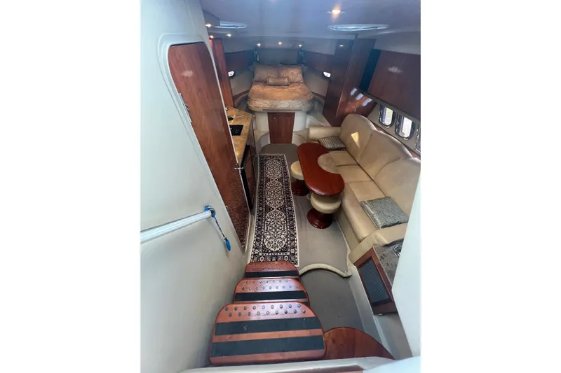  Yacht Photos Pics 2008 Cruisers Yachts 330 Express interior with cozy seating and elegant wood finishes.