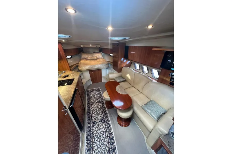  Yacht Photos Pics Luxurious interior of 2008 Cruisers Yachts 330 Express with elegant seating and cozy sleeping area.
