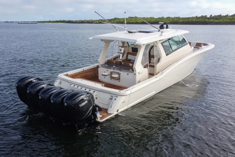  Yacht Photos Pics 2020 Scout 530 LXF boat with Yamaha engines on calm water.