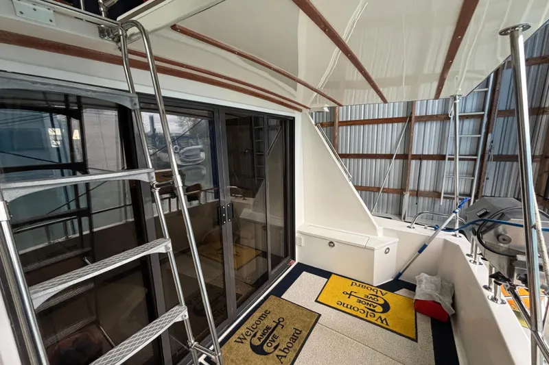 Encore II Yacht Photos Pics Cockpit with steps up to bridge and floor access to engine room