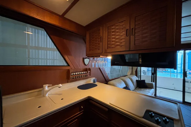 Encore II Yacht Photos Pics Galley with Corian countertop, matching inserts for double sink and cover for cooktop