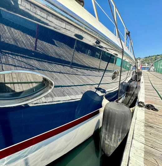  Yacht Photos Pics 1998 Sunseeker Predator 63 yacht docked at marina, side view.