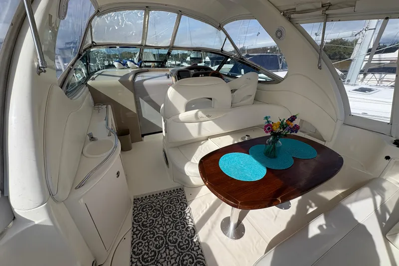 Devocean Yacht Photos Pics Luxurious 2003 Sea Ray 360 Sundancer yacht interior with elegant seating and dining area.