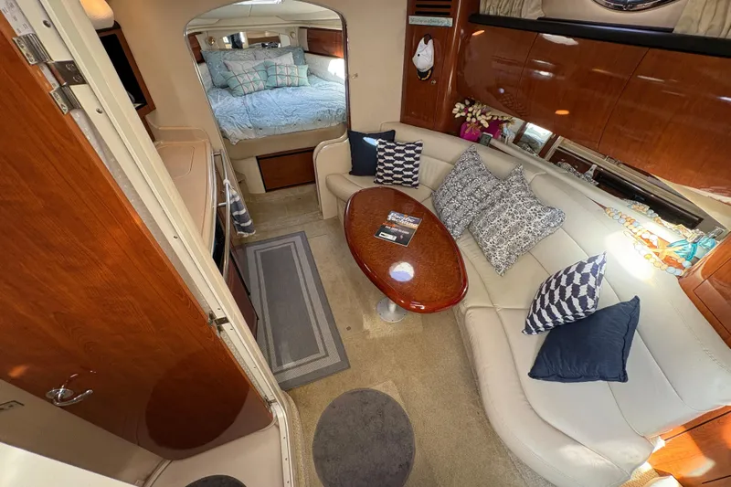 Devocean Yacht Photos Pics Luxurious interior of 2003 Sea Ray 360 Sundancer with elegant seating and cozy bedroom.