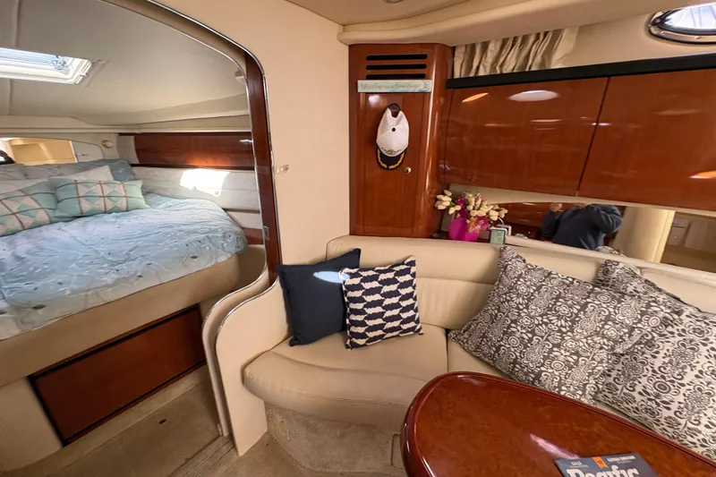 Devocean Yacht Photos Pics Interior of 2003 Sea Ray 360 Sundancer with cozy seating and elegant decor.