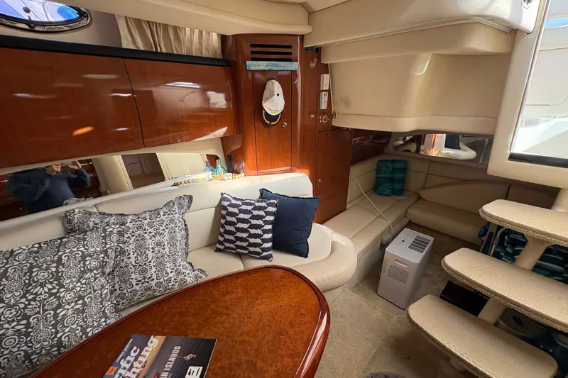Devocean Yacht Photos Pics Luxurious interior of 2003 Sea Ray 360 Sundancer yacht with elegant seating and decor.