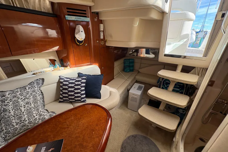 Devocean Yacht Photos Pics Luxurious interior of 2003 Sea Ray 360 Sundancer yacht with plush seating and elegant decor.