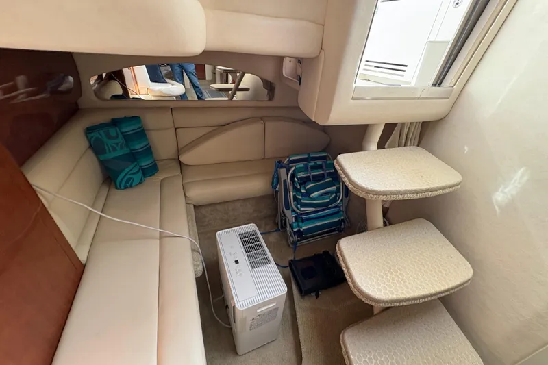 Devocean Yacht Photos Pics Interior of 2003 Sea Ray 360 Sundancer with beige seating and compact stairs.