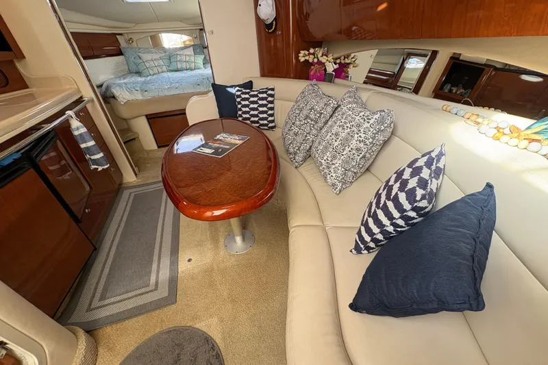 Devocean Yacht Photos Pics Luxurious interior of 2003 Sea Ray 360 Sundancer with plush seating and elegant decor.