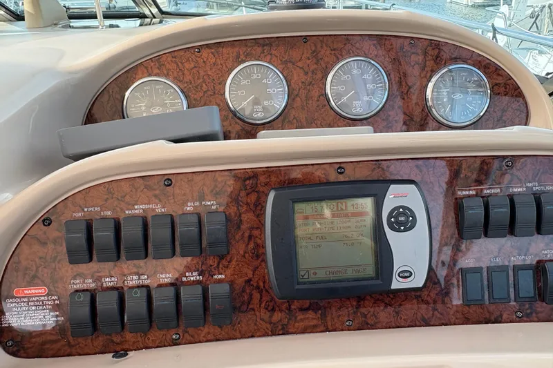 Devocean Yacht Photos Pics Control panel of a 2003 Sea Ray 360 Sundancer boat with gauges and switches.