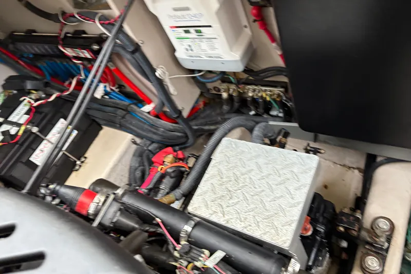 Devocean Yacht Photos Pics Engine compartment of a 2003 Sea Ray 360 Sundancer with visible wiring and components.