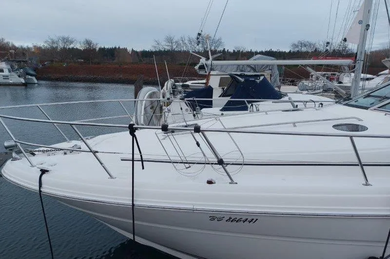 Devocean Yacht Photos Pics 2003 Sea Ray 360 Sundancer yacht docked in a marina, side view.