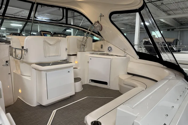  Yacht Photos Pics 2005 Cruisers Yachts 420 Express interior with seating and helm, showcasing luxury design.