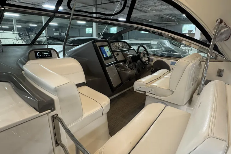  Yacht Photos Pics 2005 Cruisers Yachts 420 Express interior with white seating and modern dashboard.