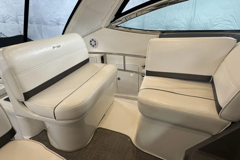  Yacht Photos Pics 2005 Cruisers Yachts 420 Express interior seating with white upholstery and modern design.