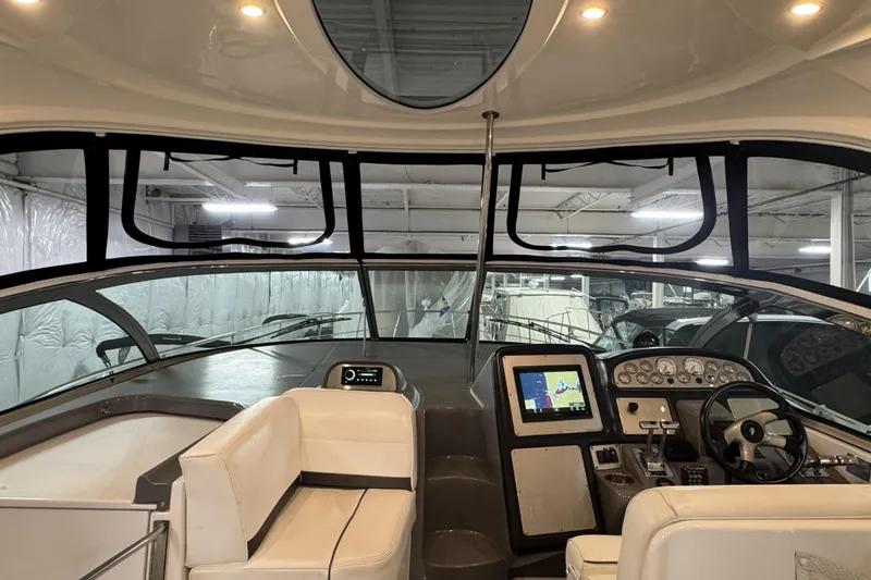  Yacht Photos Pics 2005 Cruisers Yachts 420 Express helm with modern navigation equipment and comfortable seating.