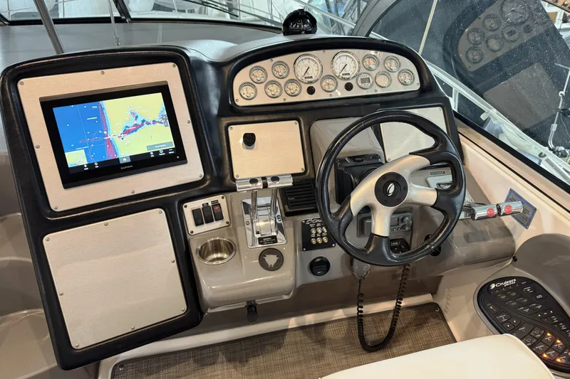  Yacht Photos Pics Dashboard of 2005 Cruisers Yachts 420 Express with navigation system and steering wheel.