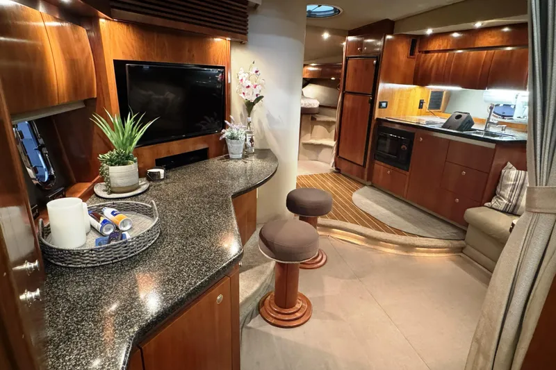  Yacht Photos Pics Luxurious interior of 2005 Cruisers Yachts 420 Express with modern amenities and elegant design.